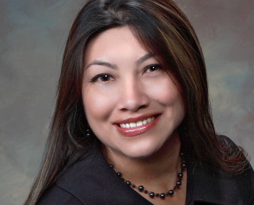 woman with long dark hair wearing black top