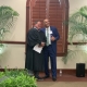 Judge shaking hands with smiling man
