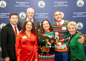 Group of smiling people in festive holiday attire