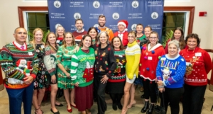 Group of people wearing festive holiday attire