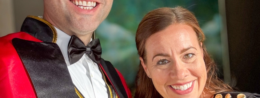 two persons smiling for the camera